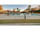 Large community pool with water slide and lounging area at 10150 Timber Willow Ave, Las Vegas, NV 89135