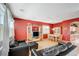 Dining room with red walls and kitchen view at 10150 Timber Willow Ave, Las Vegas, NV 89135