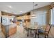 Spacious kitchen with island and wood cabinets at 10150 Timber Willow Ave, Las Vegas, NV 89135