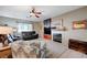 Living room with fireplace and built-in entertainment center at 10150 Timber Willow Ave, Las Vegas, NV 89135