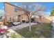 Backyard patio with seating area and mature trees at 10444 Britton Hill Ave, Las Vegas, NV 89129