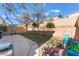 Backyard with grassy area, patio, and play equipment at 10444 Britton Hill Ave, Las Vegas, NV 89129