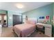 Bright bedroom with a built-in desk and plenty of light at 10444 Britton Hill Ave, Las Vegas, NV 89129