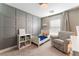 Bedroom with gray accent wall and twin bed at 10444 Britton Hill Ave, Las Vegas, NV 89129