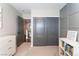 Bright bedroom with gray closet doors and built-in shelving at 10444 Britton Hill Ave, Las Vegas, NV 89129