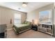 Bedroom with green bedding and a bookshelf at 10444 Britton Hill Ave, Las Vegas, NV 89129