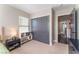 Bedroom with gray closet doors and a bookshelf at 10444 Britton Hill Ave, Las Vegas, NV 89129