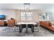 Modern dining room with a large table and black chairs at 10444 Britton Hill Ave, Las Vegas, NV 89129