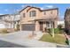 Two-story house with brown accents and a landscaped front yard at 10444 Britton Hill Ave, Las Vegas, NV 89129