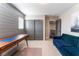 Home office with gray shiplap wall and mid-century desk at 10444 Britton Hill Ave, Las Vegas, NV 89129