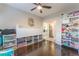 Spacious playroom with ample storage and a ceiling fan at 10444 Britton Hill Ave, Las Vegas, NV 89129