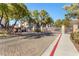 Gated community entrance with brick pavers and landscaping at 108 Breezy Tree Ct # 202, Las Vegas, NV 89145