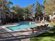 Refreshing community pool with lounge chairs and a relaxing atmosphere at 108 Breezy Tree Ct # 202, Las Vegas, NV 89145