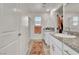 Main bathroom with granite countertop and shower at 10931 Cambridge Lakes Ave, Las Vegas, NV 89166