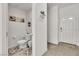 Clean and simple half bathroom with white fixtures at 10931 Cambridge Lakes Ave, Las Vegas, NV 89166