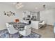 Open concept dining area with a granite table and kitchen views at 10931 Cambridge Lakes Ave, Las Vegas, NV 89166