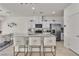 Modern kitchen with white cabinets, granite countertops and stainless steel appliances at 10931 Cambridge Lakes Ave, Las Vegas, NV 89166