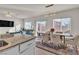 Modern kitchen with granite countertops and white cabinets at 10931 Cambridge Lakes Ave, Las Vegas, NV 89166