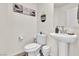 Clean powder room with pedestal sink and toilet at 10931 Cambridge Lakes Ave, Las Vegas, NV 89166