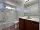 Bathroom with tub, shower, and wood vanity at 1096 Country Coach Dr, Henderson, NV 89002