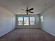 Bedroom with ceiling fan and multiple windows at 1096 Country Coach Dr, Henderson, NV 89002