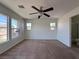 Main bedroom with ceiling fan and large windows at 1096 Country Coach Dr, Henderson, NV 89002