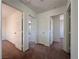 Hallway with carpet and multiple doors to bedrooms at 1096 Country Coach Dr, Henderson, NV 89002