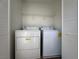 Laundry room with washer, dryer, and shelving at 1096 Country Coach Dr, Henderson, NV 89002