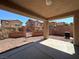 Covered patio with a view of the backyard and neighboring houses at 1096 Country Coach Dr, Henderson, NV 89002