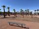 Community playground with swings and a shaded sitting area at 1096 Country Coach Dr, Henderson, NV 89002