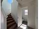 Staircase with brown carpet leading to upper level at 1096 Country Coach Dr, Henderson, NV 89002