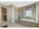 Spa-like bathroom with large shower, soaking tub, and walk-in closet at 11275 Idyllic Dr # 101, Las Vegas, NV 89135