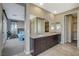 Double vanity bathroom with walk in closet and bedroom view at 11275 Idyllic Dr # 101, Las Vegas, NV 89135