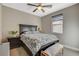 Bedroom with ceiling fan, window, and patterned bedding at 11275 Idyllic Dr # 101, Las Vegas, NV 89135