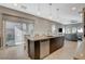 Kitchen with island, stainless steel dishwasher, and view into living room at 11275 Idyllic Dr # 101, Las Vegas, NV 89135