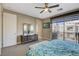 Main bedroom with king bed, dresser, and access to balcony at 11275 Idyllic Dr # 101, Las Vegas, NV 89135