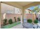 Private patio with seating area and landscaping at 11275 Idyllic Dr # 101, Las Vegas, NV 89135