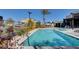 Community pool and spa with lounge chairs and ample space for relaxation at 11275 Idyllic Dr # 101, Las Vegas, NV 89135