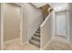 Modern staircase with neutral-toned carpet and tile flooring at 11275 Idyllic Dr # 101, Las Vegas, NV 89135