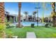 Inviting swimming pool with lounge chairs and landscaping at 11275 Idyllic Dr # 101, Las Vegas, NV 89135