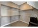 Spacious walk-in closet with ample shelving and hanging rods at 11275 Idyllic Dr # 101, Las Vegas, NV 89135