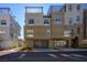 Modern townhome featuring a private two-car garage, multiple stories, and a sleek, neutral color palette at 11809 Stone Run Ave, Las Vegas, NV 89138