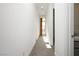 Bright hallway with carpet and large window at 11809 Stone Run Ave, Las Vegas, NV 89138