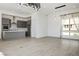 Modern kitchen with gray cabinets and an island at 11809 Stone Run Ave, Las Vegas, NV 89138