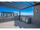 Outdoor kitchen with pergola and mountain views at 11809 Stone Run Ave, Las Vegas, NV 89138