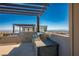 Outdoor kitchen and dining area with mountain views at 11809 Stone Run Ave, Las Vegas, NV 89138