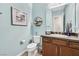 Light and airy powder room with modern vanity and fixtures at 12031 Attiva Ave, Las Vegas, NV 89138