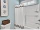 Bathroom with shower/tub combo and white subway tile at 12031 Attiva Ave, Las Vegas, NV 89138