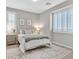 Bright bedroom with queen bed and plantation shutters at 12031 Attiva Ave, Las Vegas, NV 89138