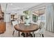 Bright dining area with a round table and four upholstered chairs at 12031 Attiva Ave, Las Vegas, NV 89138